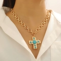 Detail of a vintage gold necklace with turquoise cross pendant on a female model - Gold Turquoise Necklace (X360)