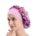 Floral purple satin sleep cap with wide pink elastic band shown on a model - Purple