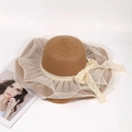 Detail of handwoven straw hat with delicate white lace lace bow and elegant mesh brim trim - M (56-58cm) / Coffee