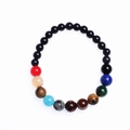 Detail shot of colorful gemstone bead bracelet with galaxy sandstones on white background - Multicolor-Black