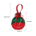Christmas ball-shaped gift bag in red and green with snowflake print and red ribbon bow - Christmas Ball Ornament Style