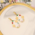 Detail of gold oval earrings with colorful zircons and heart charms on marble tray - Oval Heart Style (9#)