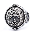 Macro shot of silver Tree of Life ring with vintage engraving and blackened textures - Antique Silver