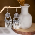 Detail view of vintage silver earrings with metallic fringe on a natural wooden branch - E2874-12/Disc Crescent Tassel