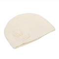 Detail showing cream knit texture and delicate crochet flowers on the beanie hat - White
