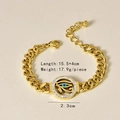Détail d'un bracelet œil d'Horus doré avec émail bleu et cristaux blancs, longueur 15,5+4cm - Bracelet