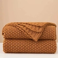 Chunky knit amber yellow throw blanket with nordic tassel design for sofa or bed decor - Orange