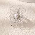Detailed macro view of an intricate silver hollow flower ring with a central pearl inlay - Retro Hollow Flower (Silver) (RZ0874yinse)