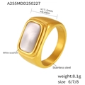 Detail view of gold stainless steel ring with white seashell inlay and 11.2mm width - US 6 / Gold