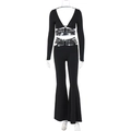 Detail of black V-neck crop top with criss-cross waist ties and wide-leg flare pants - S / Black