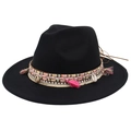 Detailed shot of ethnic fedora hat with shells, colorful tassels and woven band decor - Black