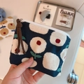 Detail of floral linen coin purse with blue dot pattern and brown braided zipper pull - Navy with White Floral