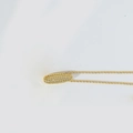 Chubby gold necklace with an oval pendant featuring micro-pave crystals and a thin chain - Letter I