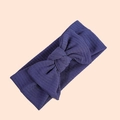 Macro shot of dark blue ribbed knit fabric baby headband with elegant bow decoration - Navy Blue