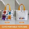 Cartoon monster white canvas handbag with vibrant yellow handles and snap button closure - Cute Monster Group-White
