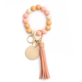 Silicone beaded keychain bracelet in dusty pink and checkerboard patterns with wood charm - Peach Pink