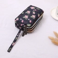 Three-layer canvas floral clutch with flamingo pattern and convenient wristlet strap - Flamingo