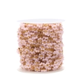 Detailed macro view of 1.5mm pink beaded flower chain with gold stainless steel finish - Pink