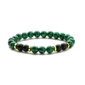 8mm beads bracelet with green malachite, black matte stones and golden metal spacers on white - Malachite