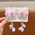 Close-up of pink butterfly hair clips with beaded tassels and silver metallic accents - Pink Bead Butterfly