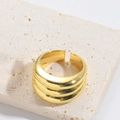 Detail of adjustable gold knot ring with triple-layered design on natural stone base - Three-Layer Style (JZ0460-2)