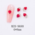 Macro shot of 6x8mm red heart nail art crystal with silver rhinestones, model MZH-9680 - Half Circle Pave Heart Nail Art Charm (9680)