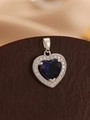 Macro detail of heart pendant featuring deep blue gemstone and sparkling zircon halo - Silver Royal Blue
