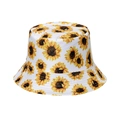 Detail shot of white cotton bucket hat with vibrant yellow sunflower floral prints - White Base Sunflower Print (11)