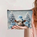 Highland cow printed makeup bag with festive winter scenery and secure zipper closure - Winter Highland Cow with Blue Hat (jiayingpbb094)