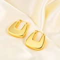 Polished 18K gold geometric U-shaped hoop earrings on elegant silk background - U-Shape Geometric Hoop