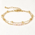 Detailed macro of a double-layered gold bracelet with pink matte beads and bead accents - Matte Pink