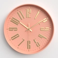 Modern 12-inch coral pink wall clock featuring 3D golden numerals and radial texture - Pale Pink