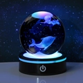 3D laser engraved crystal ball night light featuring dolphins and moon with blue LED base - Dolphin