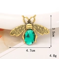 Golden vintage bee charm with green gemstone inlay and wing details, size 4.7cm x 3.5cm - Gold/Green Bee
