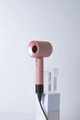 Pink high-speed bladeless hair dryer with ionic technology on white display stands - US Plug 110V-1.8m-Single Nozzle / Sunset Rose