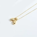 Detailed close-up of a luxury gold bubble letter A pendant on a fine chain necklace - Letter A