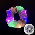 Silver satin LED scrunchie showing glowing multi-color light and unlit fabric detail - Glowing Grey