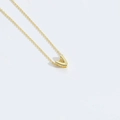 Minimalist golden necklace with a polished 3D letter V pendant on a fine link chain - Letter V