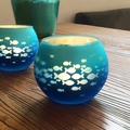 Set of two blue gradient glass candle holders with fish cutout patterns on wood - Blue Fish Leap