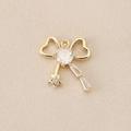 Detailed macro view of gold-plated copper bow pendant with sparkling zircon inlays - PJ0177-Gold Double Heart Star Tassel
