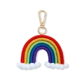 Detail of handmade woven rainbow car pendant with colorful cotton rope and soft white pom-poms - Red Rainbow