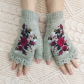 Close-up of light green knitted fingerless glove with floral and bee embroidery detail - One Size / Light Gray