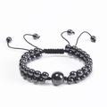 Pulsera ajustable de doble capa de ojo de tigre con cuentas magnéticas negras en fondo blanco - Pulsera de Piedra Magnética