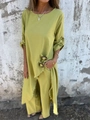 Detail of green linen set showing metal buckle and tassel hem on the long tunic top - S / Yellow