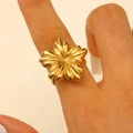 Exaggerated golden flower hollow ring featuring vintage floral petals on finger - Gold (0811)