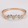 Roségouden roestvrijstalen armband met vierkante turquoise en zirkoon diamanten schakels - Roségoud