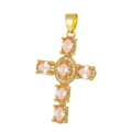 Macro shot of gold cross pendant with oval orange zircon stones on white background - Pendant 57 (Gold Orange Stone Decor Cross)