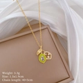 Macro shot of gold lemon necklace with green enamel, zircons and white pearls details - Titanium Steel Chain Copper Pendant / Lemon Pendant Necklace (C251)