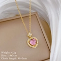 Detail shot of a gold heart pendant with pink zircon on a jewelry box, 4.2g weight - Stainless Steel/Copper/Zirconia / Starburst Pink Heart Style (H343)
