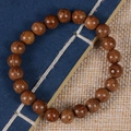 Ethnic style golden sandalwood beaded bracelet with natural wood grain on a vintage background - Premium Single Loop / 8mm*22 Beads